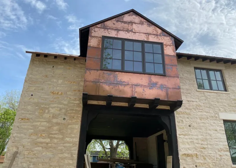 Copper metal panel facade on a stone building for Metal Roof Coating in Santee